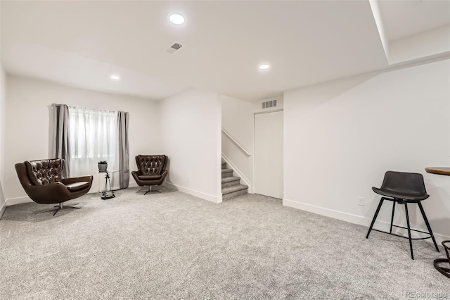 sitting room with stairway, visible vents, carpet floors, baseboards, and recessed lighting