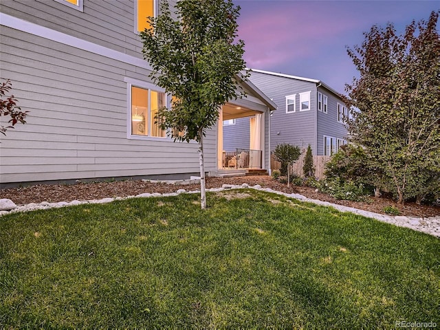 view of front of property with a yard and a porch