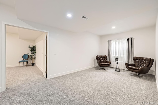 living area with recessed lighting, visible vents, carpet floors, and baseboards