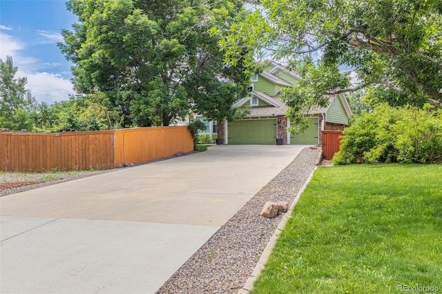392 Driftwood Cir, Lafayette, CO 80026 - view of front facade featuring driveway, a garage, and brick siding