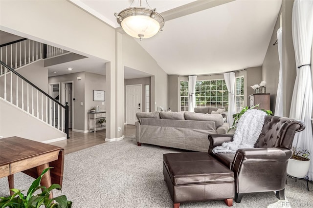 392 Driftwood Cir, Lafayette, CO 80026 - carpeted living room featuring stairway and vaulted ceiling