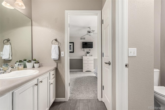 392 Driftwood Cir, Lafayette, CO 80026 - bathroom with vanity, a ceiling fan, and wood finished floors