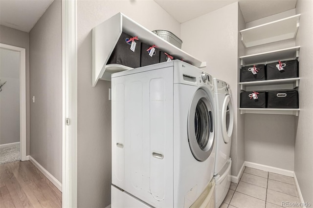392 Driftwood Cir, Lafayette, CO 80026 - washroom featuring washing machine and clothes dryer and baseboards