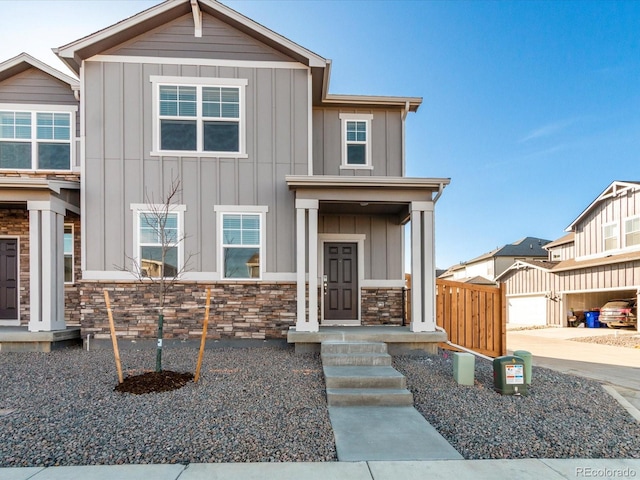 view of front of property with board and batten siding and stone siding