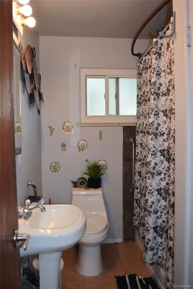 2885 Quay St, Wheat Ridge, CO 80033 - bathroom featuring tile patterned flooring, a shower with shower curtain, and toilet