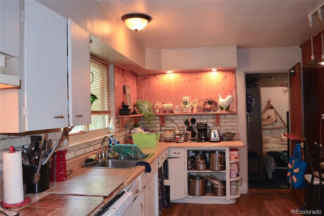 2885 Quay St, Wheat Ridge, CO 80033 - kitchen featuring a sink, white cabinets, light countertops, dark wood finished floors, and dishwashing machine