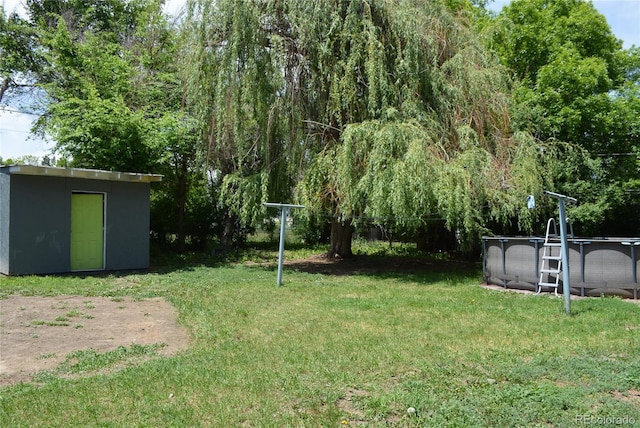 2885 Quay St, Wheat Ridge, CO 80033 - view of green lawn with an outdoor pool
