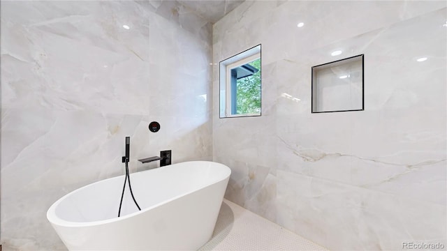 2405 S Franklin, Denver, CO 80210 - full bathroom featuring tile walls and a freestanding bath