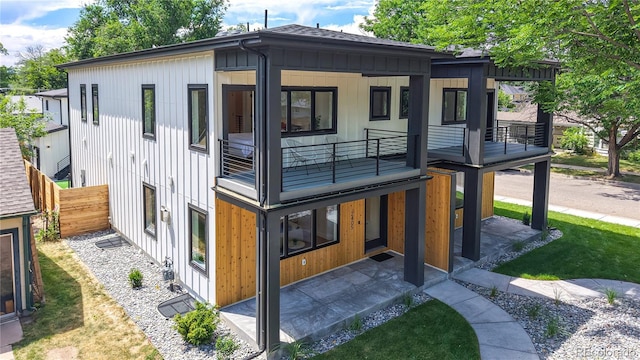 2405 S Franklin, Denver, CO 80210 - back of property with a balcony and a shingled roof