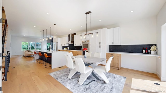 2405 S Franklin, Denver, CO 80210 - dining space featuring light wood-style flooring and recessed lighting