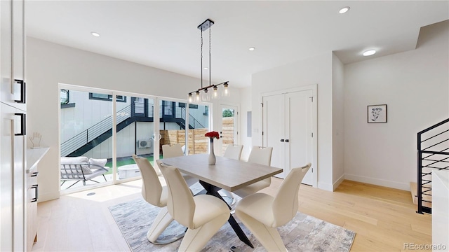 2405 S Franklin, Denver, CO 80210 - dining room with light wood finished floors, recessed lighting, and stairs