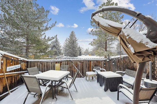 view of snow covered deck