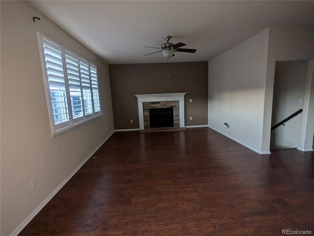 unfurnished living room featuring dark hardwood / wood-style flooring, a fireplace, and ceiling fan