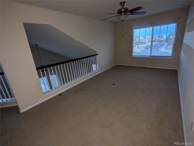 empty room with carpet floors and ceiling fan