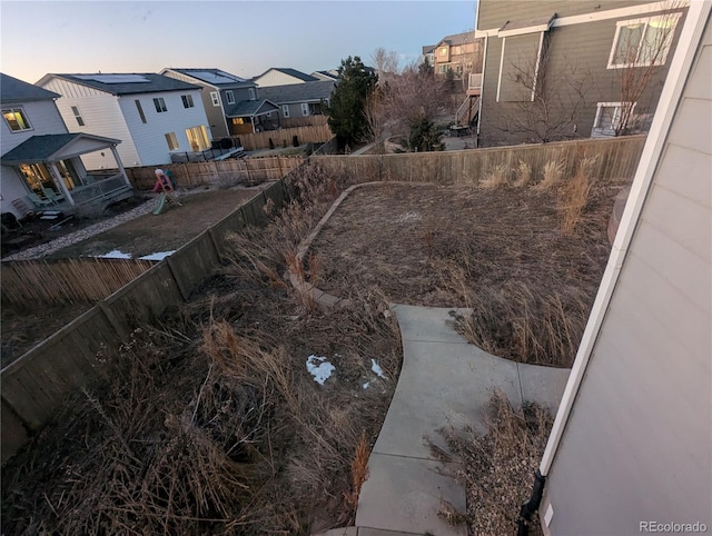 view of yard at dusk