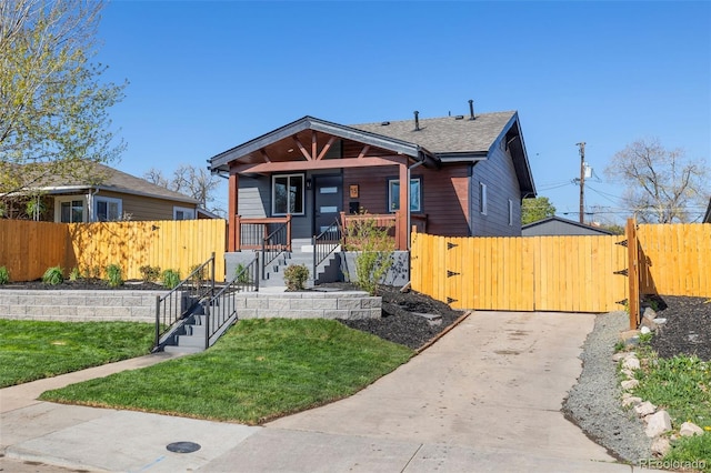 15 Hazel Ct, Denver, CO 80219 - bungalow-style house with a gate, a porch, concrete driveway, and stairway