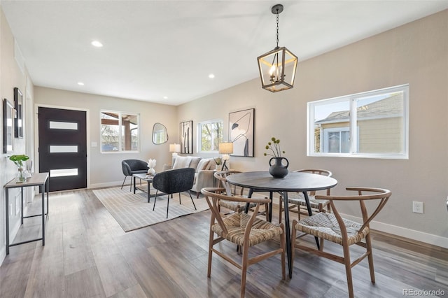 15 Hazel Ct, Denver, CO 80219 - dining area with wood finished floors, a chandelier, baseboards, and recessed lighting