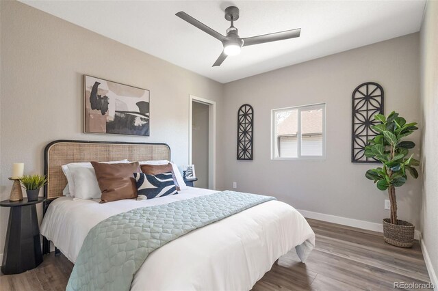 15 Hazel Ct, Denver, CO 80219 - bedroom with baseboards, wood finished floors, and a ceiling fan