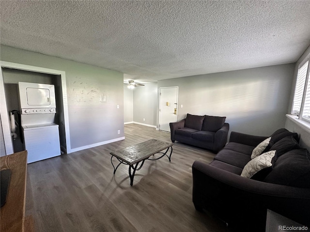 10211 Ura Ln Unit 7-108, Thornton, CO 80260 - living area with stacked washer / dryer, a textured ceiling, wood finished floors, a ceiling fan, and baseboards