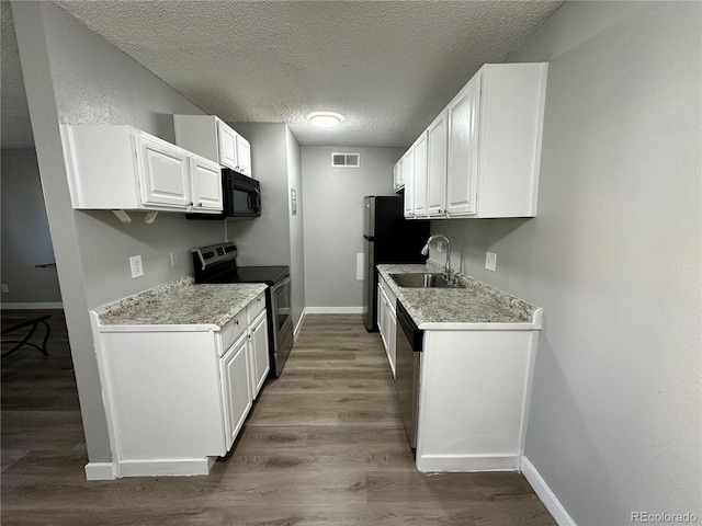 10211 Ura Ln Unit 7-108, Thornton, CO 80260 - kitchen featuring stainless steel appliances, a sink, baseboards, wood finished floors, and light countertops