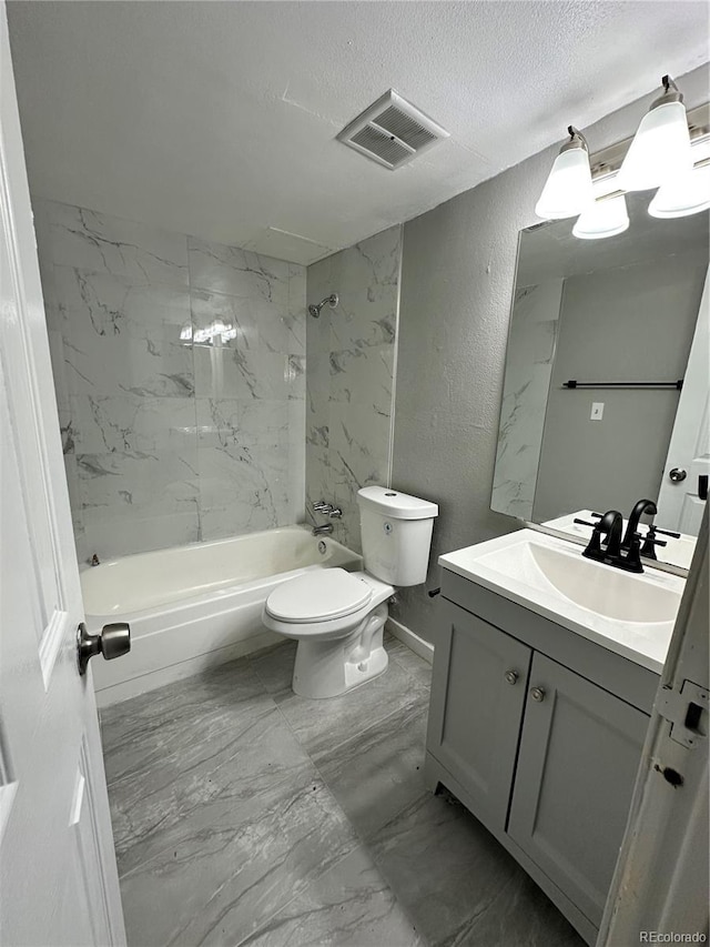 10211 Ura Ln Unit 7-108, Thornton, CO 80260 - full bathroom featuring vanity, marble finish flooring, a textured wall, toilet, and shower / bath combination