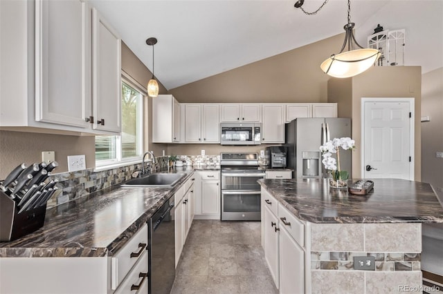 kitchen with stainless steel appliances, a sink, dark countertops, white cabinetry, and high vaulted ceiling