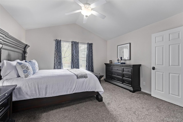bedroom with carpet flooring, vaulted ceiling, and ceiling fan
