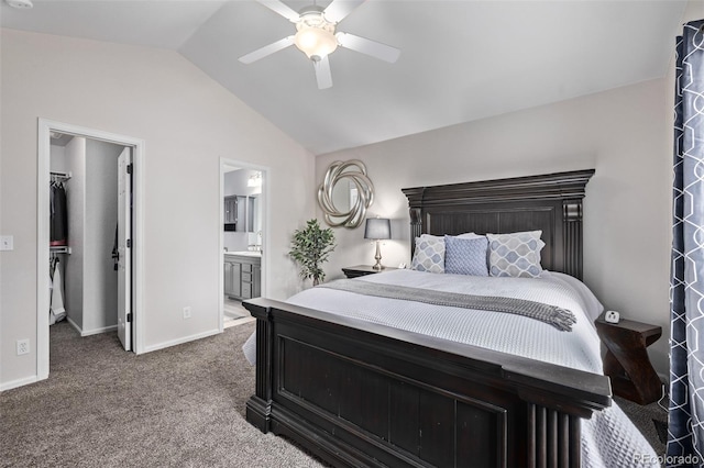 carpeted bedroom with a spacious closet, lofted ceiling, ceiling fan, ensuite bathroom, and a closet