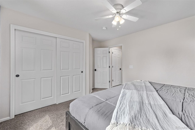 carpeted bedroom with a closet and a ceiling fan