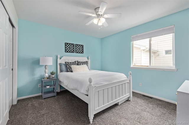 carpeted bedroom with baseboards, a closet, and a ceiling fan