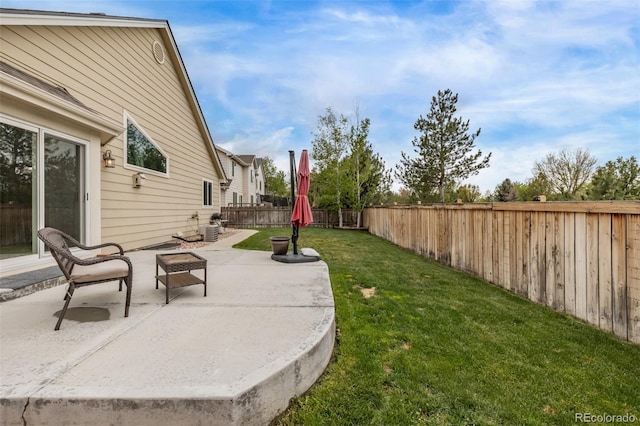view of yard featuring a patio area and central AC unit