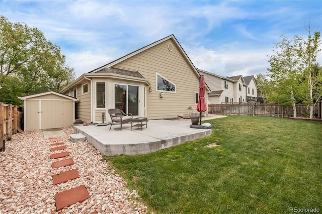 14713 Josephine St, Thornton, CO 80602 - rear view of house with a patio, a storage shed, and an outbuilding