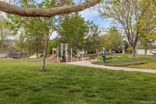 view of property's community with a lawn
