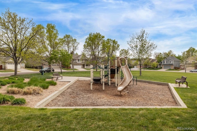 community play area with a residential view and a yard