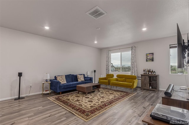 1918 W 165th Way, Broomfield, CO 80023 - living area featuring light wood finished floors and recessed lighting