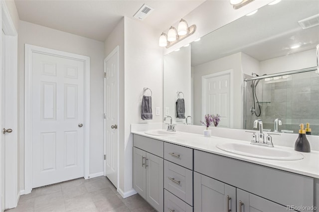 1918 W 165th Way, Broomfield, CO 80023 - full bathroom featuring double vanity, a shower stall, and tile patterned flooring