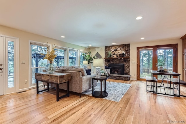 26732 Main St, Conifer, CO 80433 - living area with light wood-type flooring, a fireplace, and recessed lighting