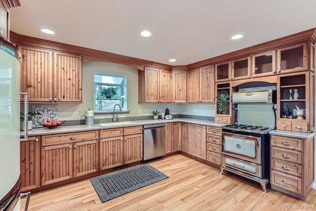 26732 Main St, Conifer, CO 80433 - kitchen with stainless steel dishwasher, gas stove, freestanding refrigerator, light wood-type flooring, and recessed lighting