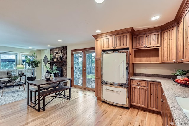 26732 Main St, Conifer, CO 80433 - kitchen with light wood-style floors, refrigerator, recessed lighting, french doors, and open shelves