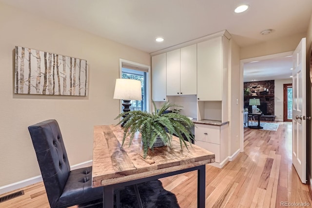 26732 Main St, Conifer, CO 80433 - home office with light wood-type flooring and recessed lighting