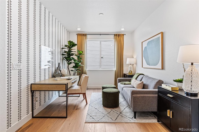 sitting room with wood-type flooring