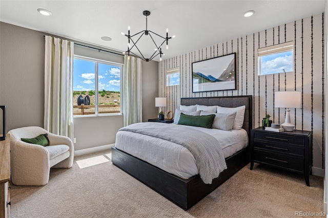 carpeted bedroom with a chandelier and multiple windows