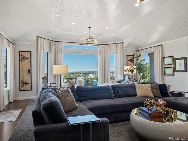 6405 Warriors Run, Littleton, CO 80125 - living area featuring a chandelier, dark wood-style floors, wooden ceiling, ornamental molding, and baseboards
