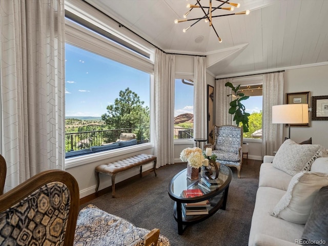 6405 Warriors Run, Littleton, CO 80125 - living area with baseboards, a chandelier, and crown molding