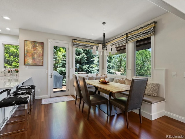 6405 Warriors Run, Littleton, CO 80125 - dining area with baseboards, healthy amount of natural light, dark wood-style flooring, and recessed lighting