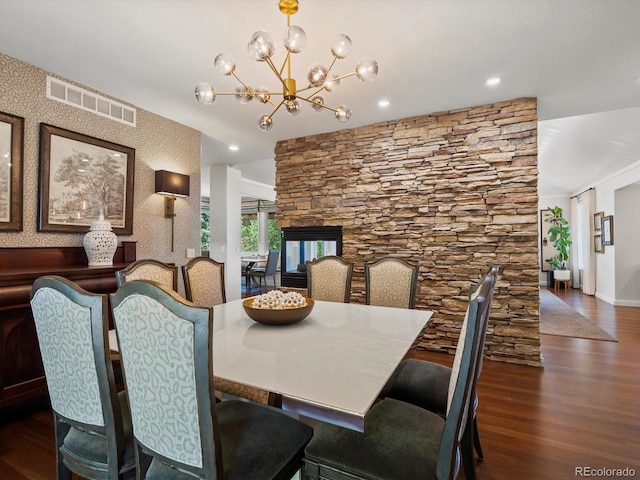 6405 Warriors Run, Littleton, CO 80125 - dining room with wood finished floors, a chandelier, baseboards, and recessed lighting