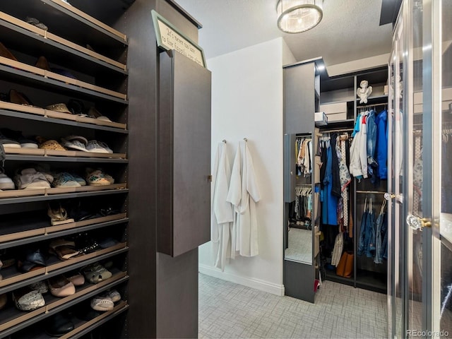 6405 Warriors Run, Littleton, CO 80125 - spacious closet featuring tile patterned flooring