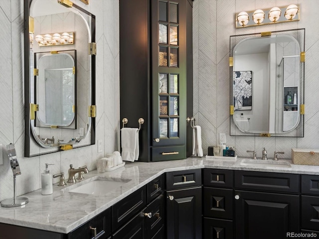 6405 Warriors Run, Littleton, CO 80125 - full bathroom featuring a shower with door and double vanity