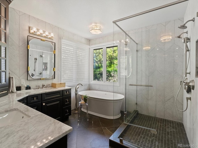 6405 Warriors Run, Littleton, CO 80125 - bathroom with a stall shower, vanity, a freestanding bath, and marble finish floors