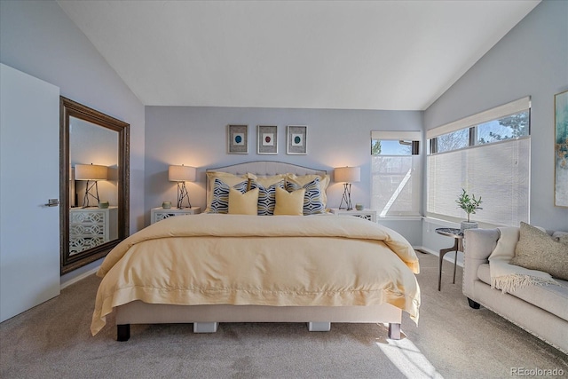 carpeted bedroom featuring vaulted ceiling